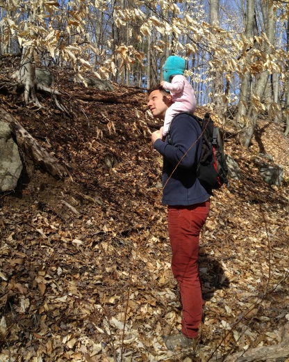 Our youngest on her father's shoulders on an early spring hike.